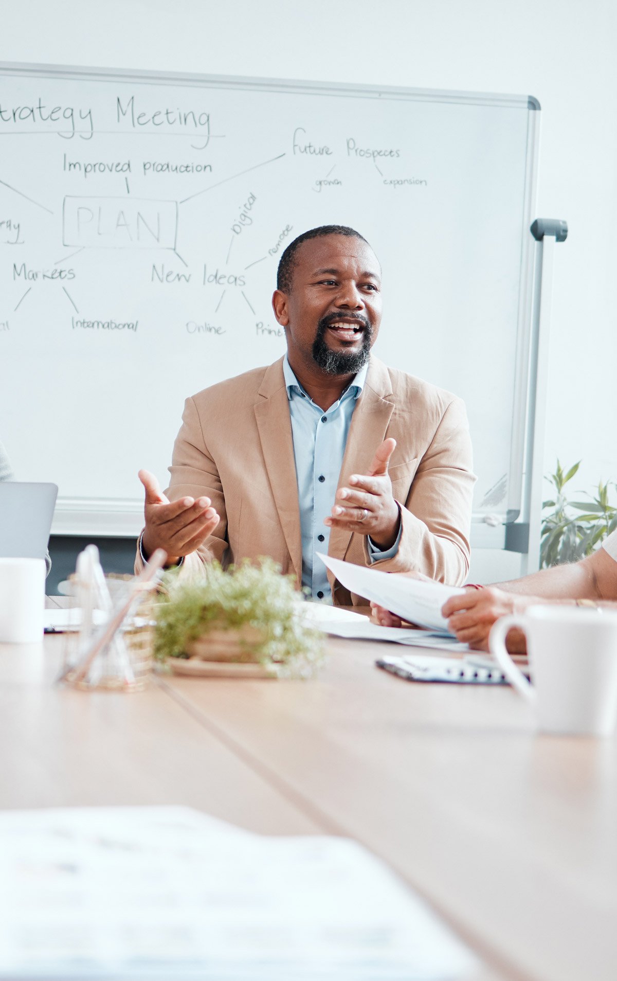 A group of people sitting around a conference table