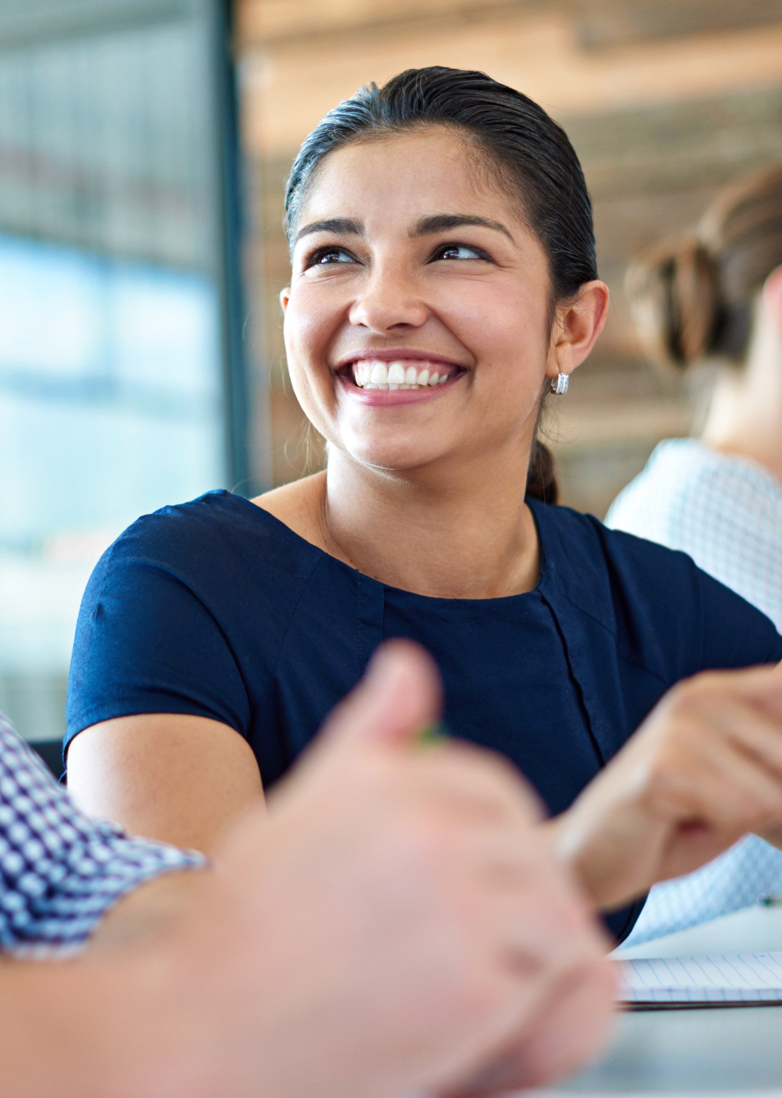 An employee smiling in a meeting