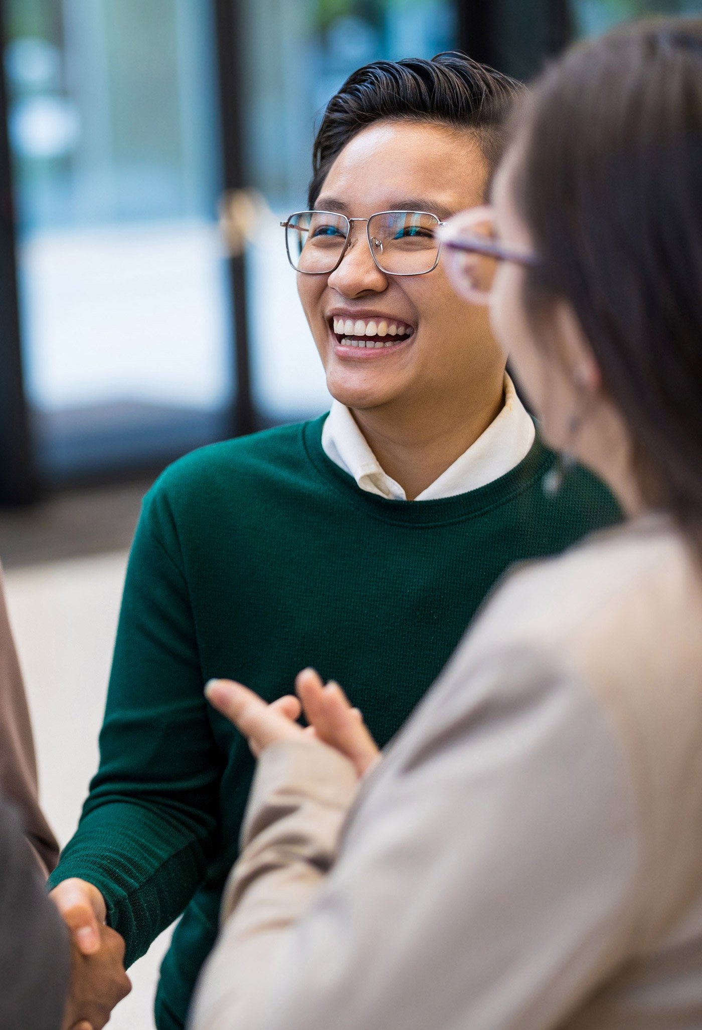 A group of potential employee talent stand talking in a circle