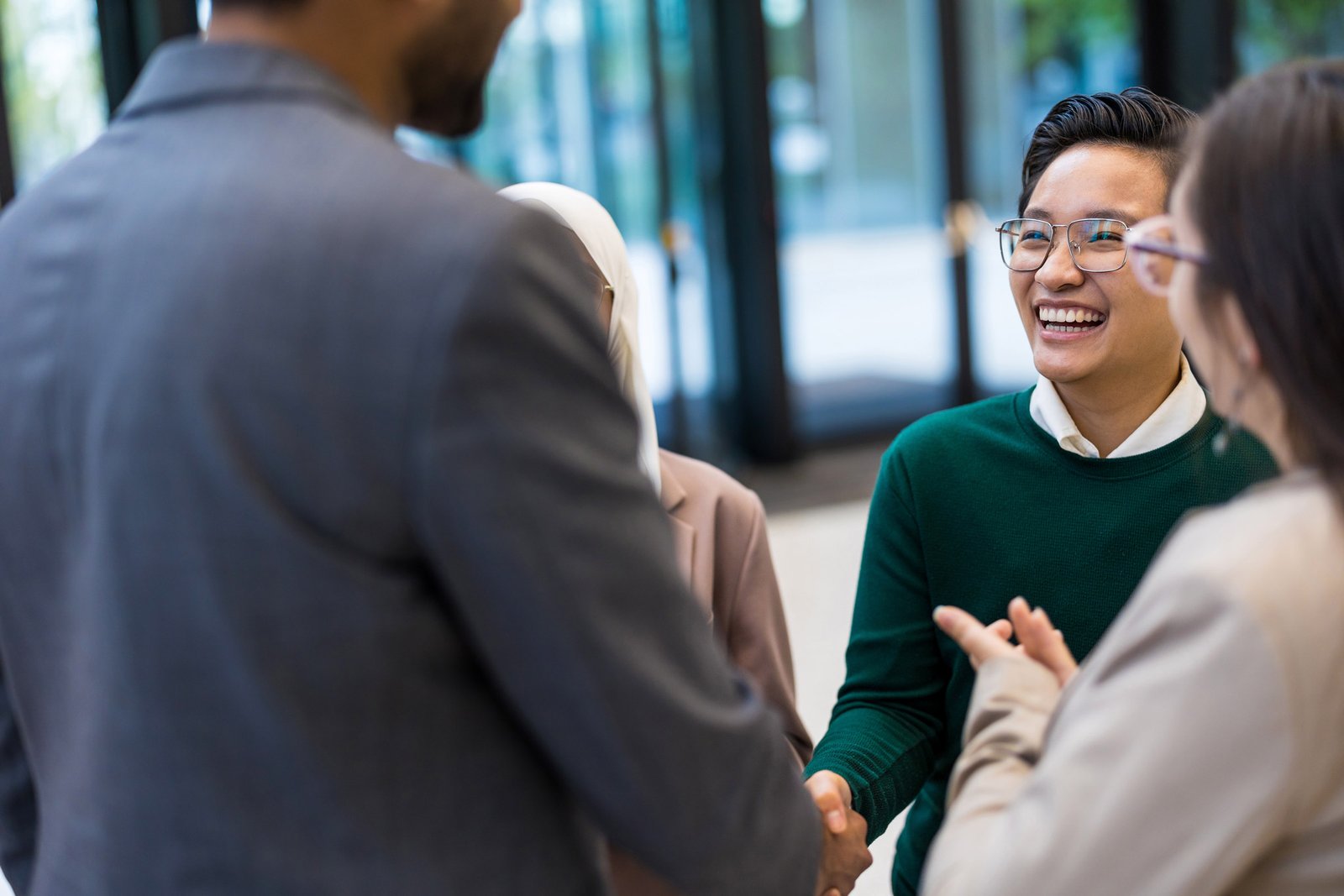 A group of potential employee talent stand talking in a circle