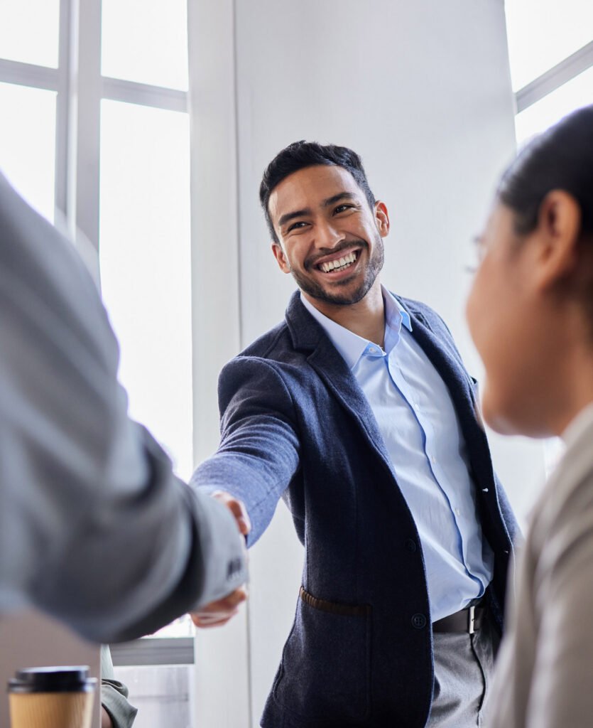An employee shaking their employers hand