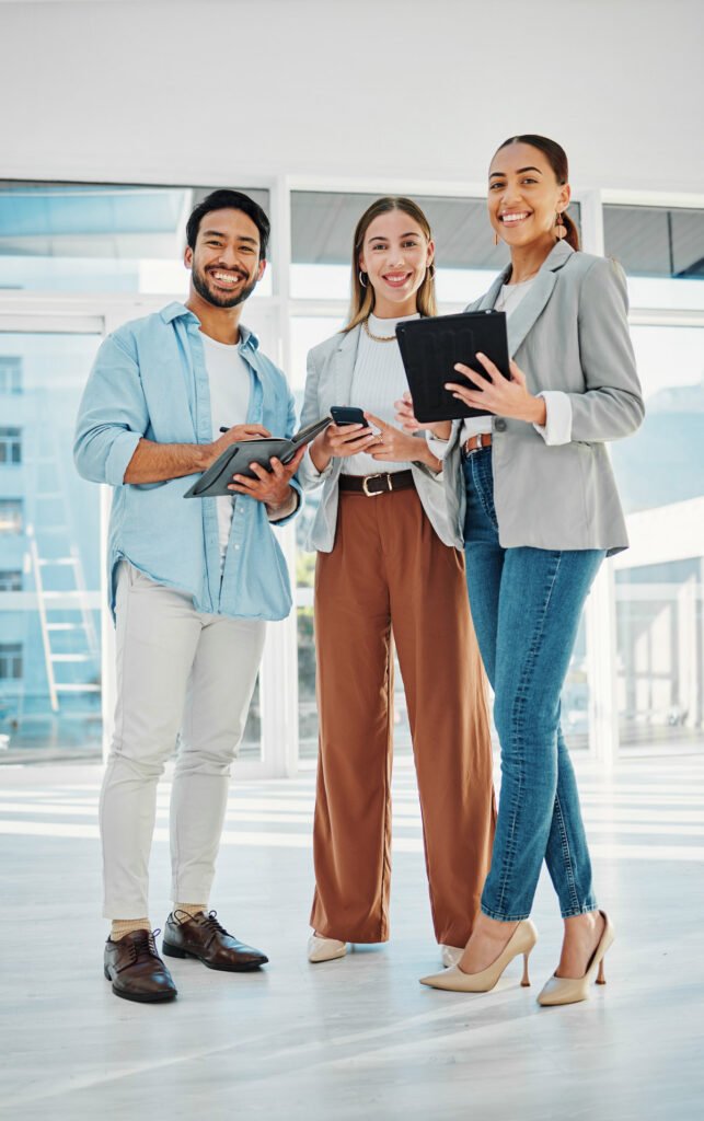 Three colleagues standing together chatting
