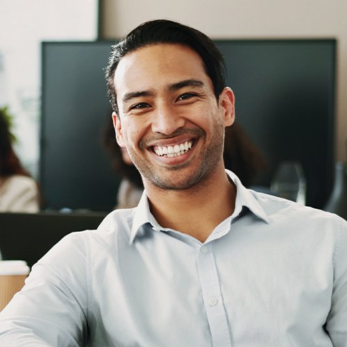 Smiling employee at their workstation