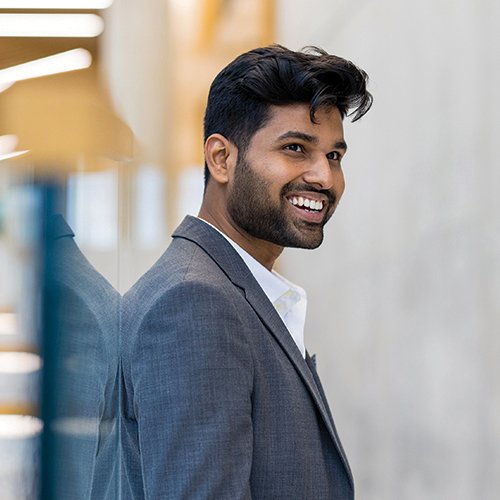 A smiling employee at a conference
